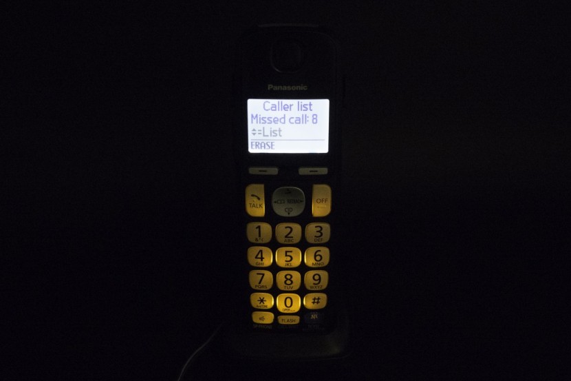 panasonic kx-tge232b - the tge232b handset in a dark environment, showing the backlit...