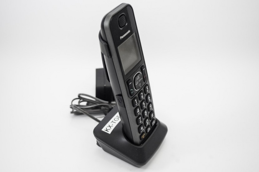 panasonic kx-tgf382m - the tgf-382m handset on its charging base.