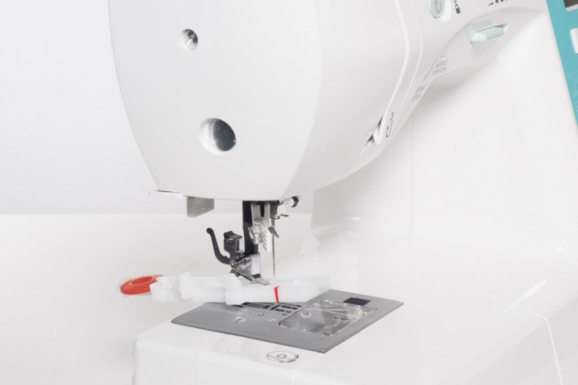 singer 7258 stylist - the presser foot for making buttonholes installed on the 7258.