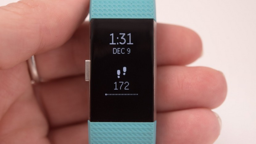 fitbit charge 2 - the home screen of the charge 2 displays the current time, date, and...