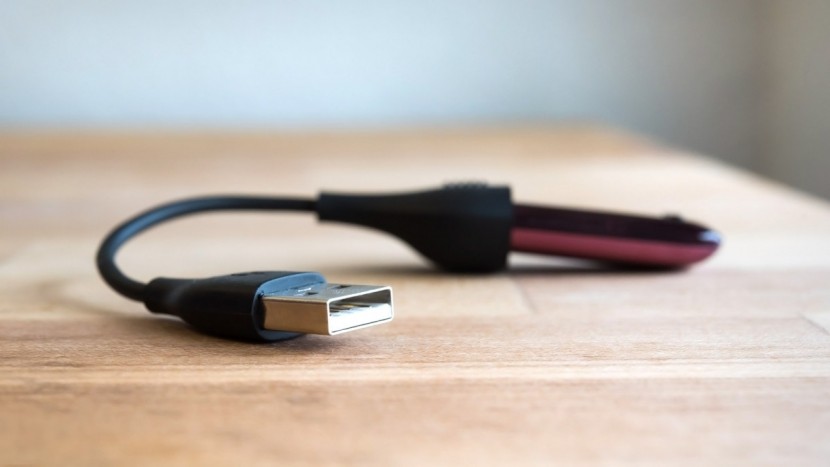 fitbit one - the one must be removed from its clip or wristband to charge via usb.