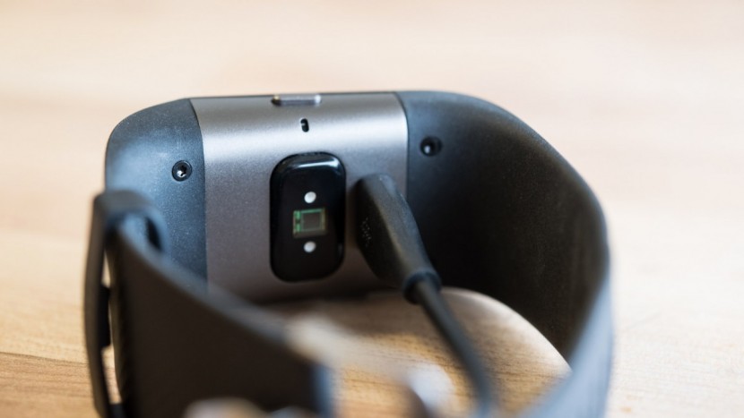 fitbit surge - the surge uses a proprietary usb charger that plugs into the...