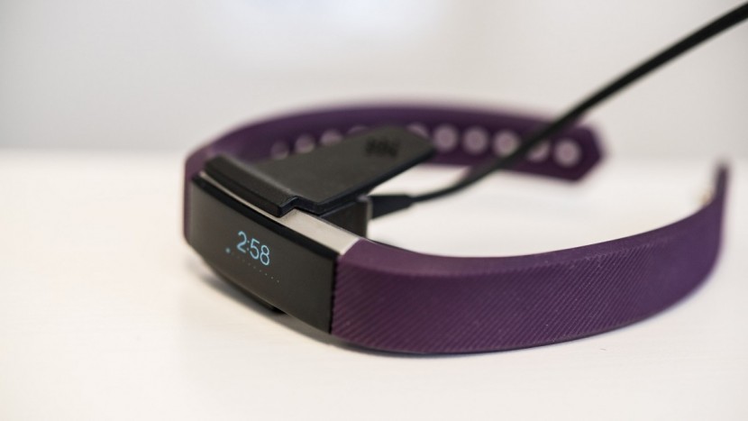 fitbit alta - the alta uses a specific usb charger that clips on the underside of...