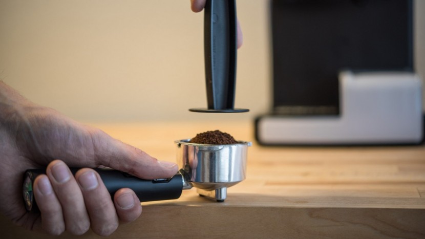 mr. coffee cafe barista - tamping grinds with the mr. coffee&#039;s flimsy tamp and portafilter...
