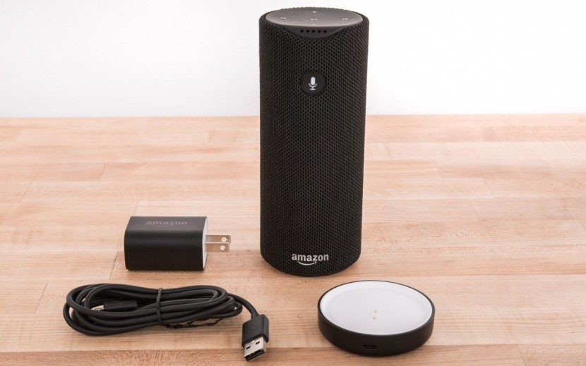 amazon tap - the tap can be charged by placing on the included charging base or...