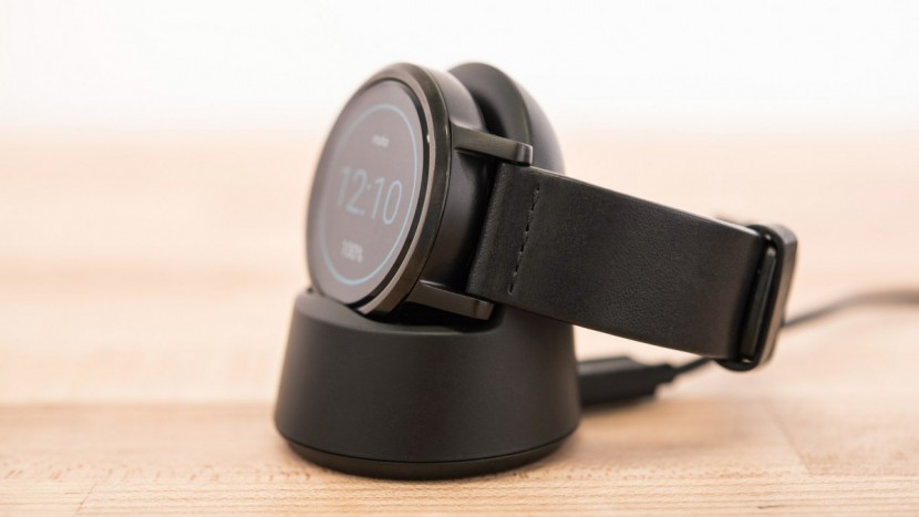 motorola moto 360 - the moto 360 sat securely in its cradle while charging, ensuring a...