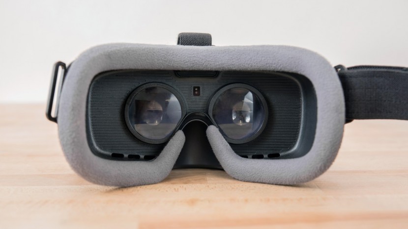 samsung gear vr - the sensor between the lenses detects if your face is there or not...