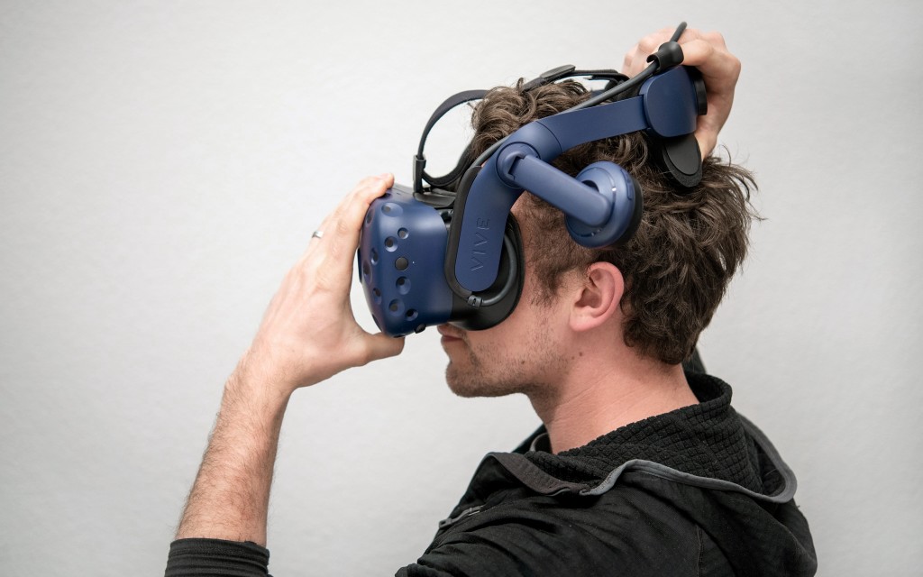 htc vive pro - you can move the integrated headphones out of the way when putting...