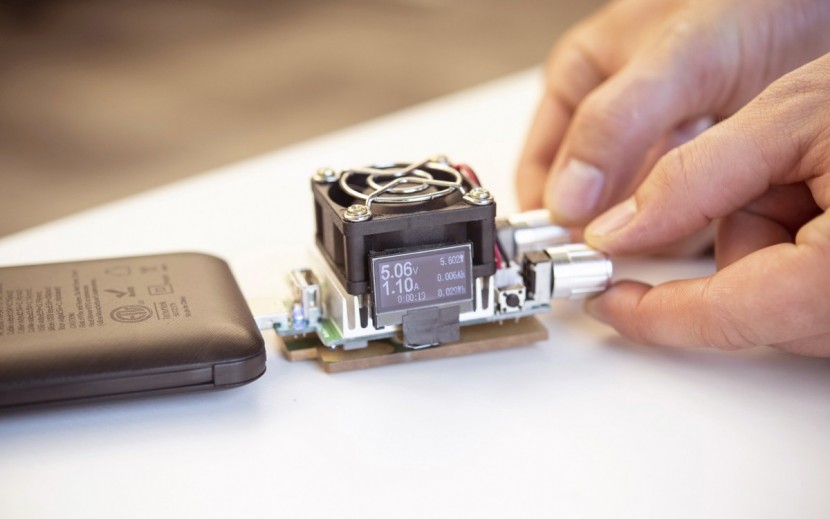testing the q slim with our resistive load and digital meter.