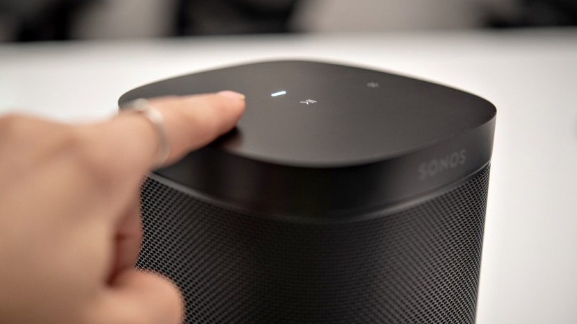sonos one sl - the top of the speaker features simple play/pause and volume touch...