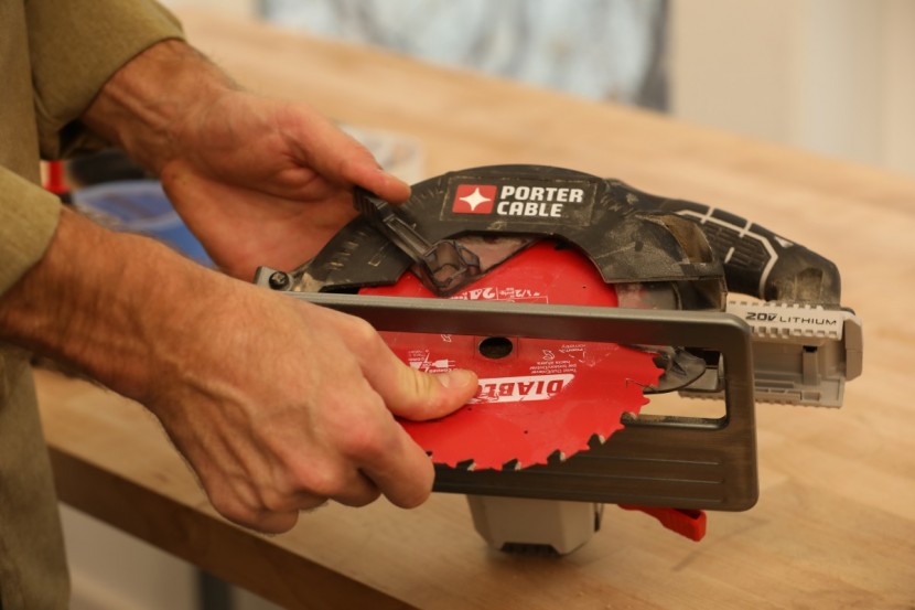 note the lower blade guard pressing against the saw blade. on the...