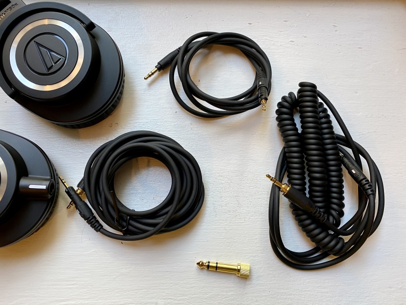 audio-technica ath-m50x - the headphones include a short cable, a long cable, and a coiled...