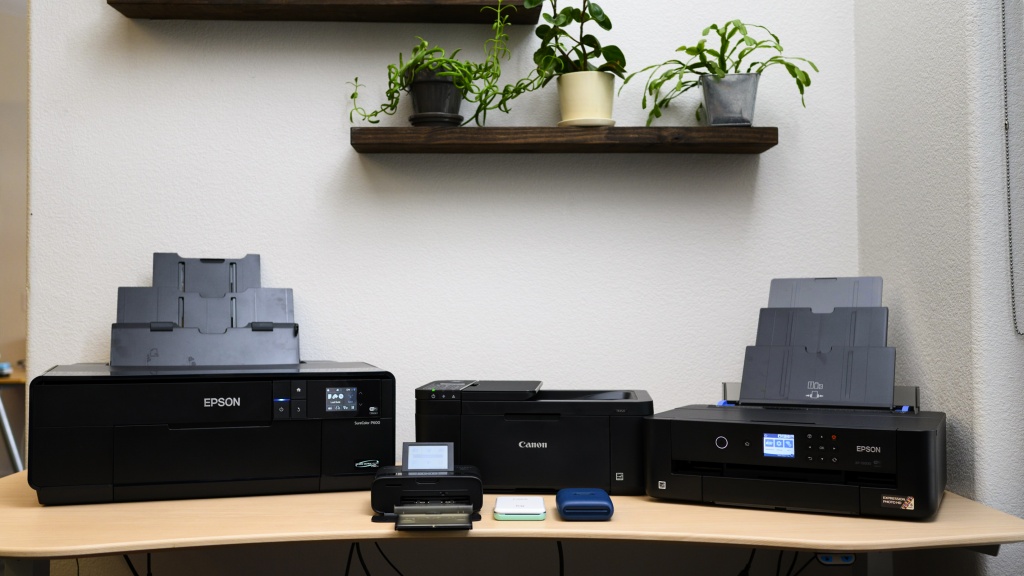 photo printer - desktop vs mini-printer. the canon selpy (front left) offers an...