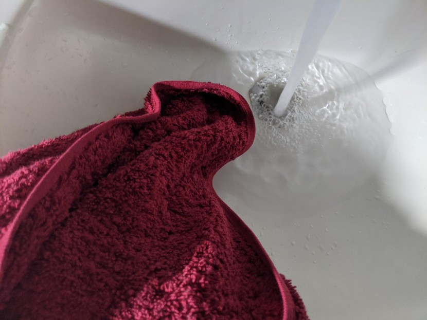 bath towel set - testing absorbancy by placing each towel into a sink full of water...