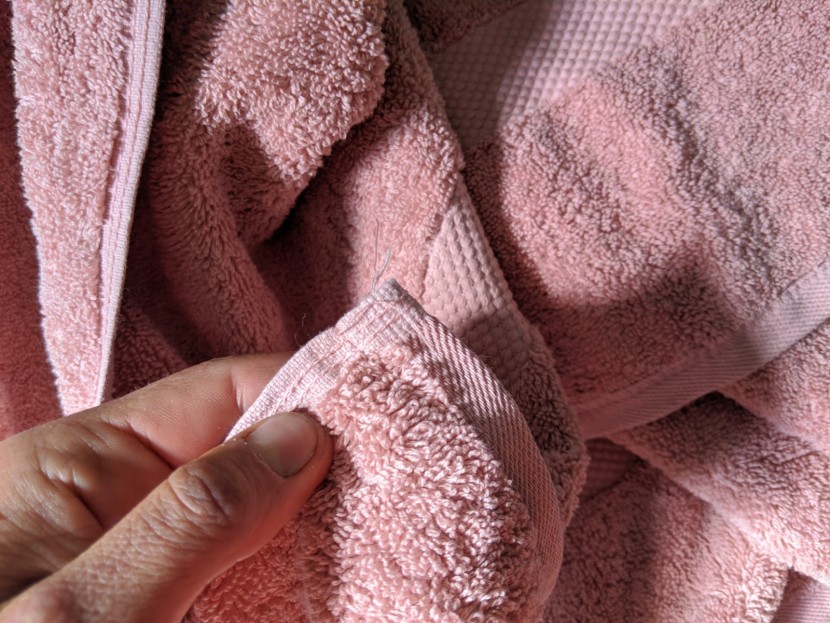 you can barely see it, but the seam above is unraveling a hair. this...