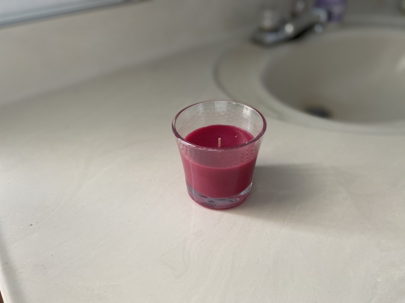 glade jar air freshener in a basic flared glass jar.