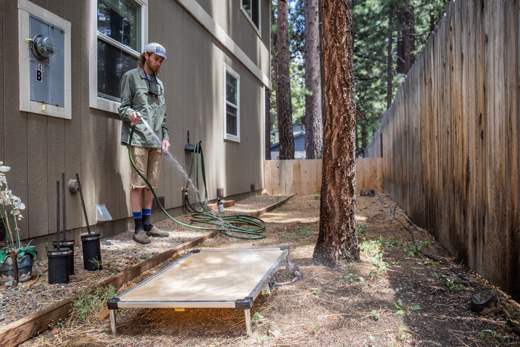 elevated dog bed - giving the k9 ballistics bed a quick rinse, showing how easy it is...