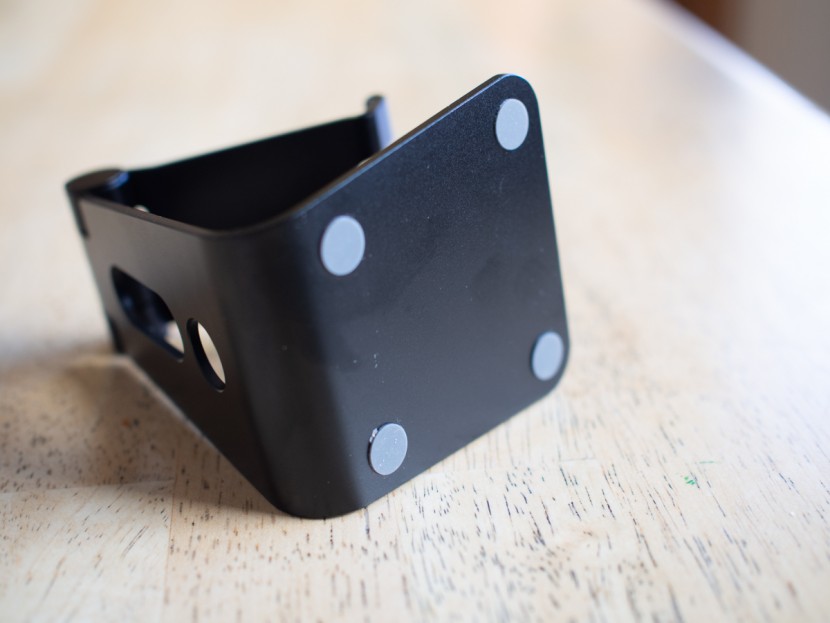 cell phone stand - the grey circles are rubberized, gripping pads. all non-clamping...