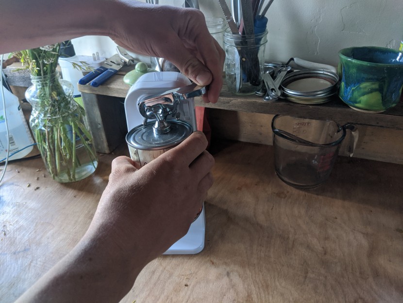 can opener - the cuisinart has a easy to operate lever that punctured the tops of...