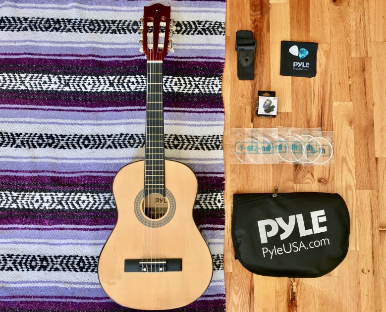 beginner acoustic guitar kit - the pyle beginner guitar is about ukulele-size and came with a lot...
