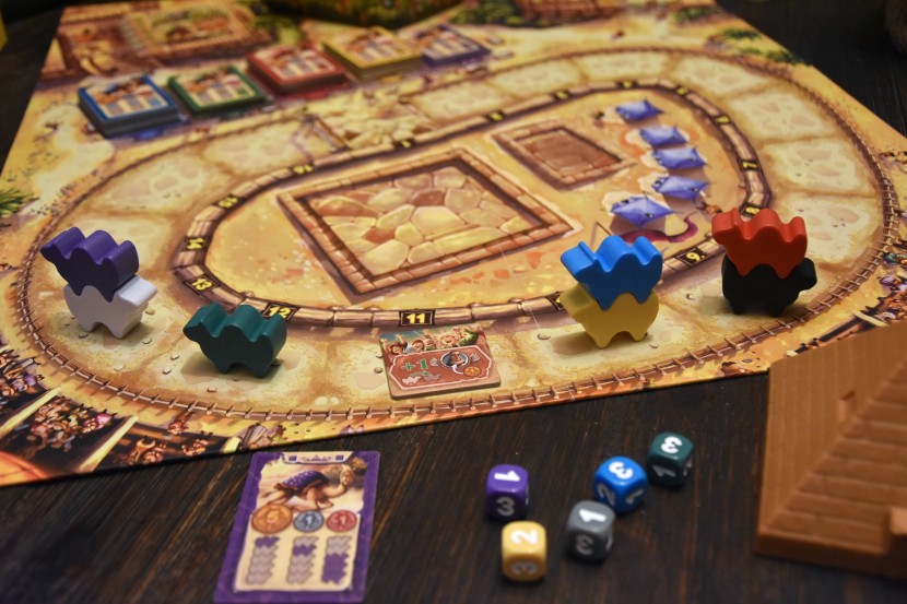 board game - camel up is a game of betting on camel races; the colored camels...