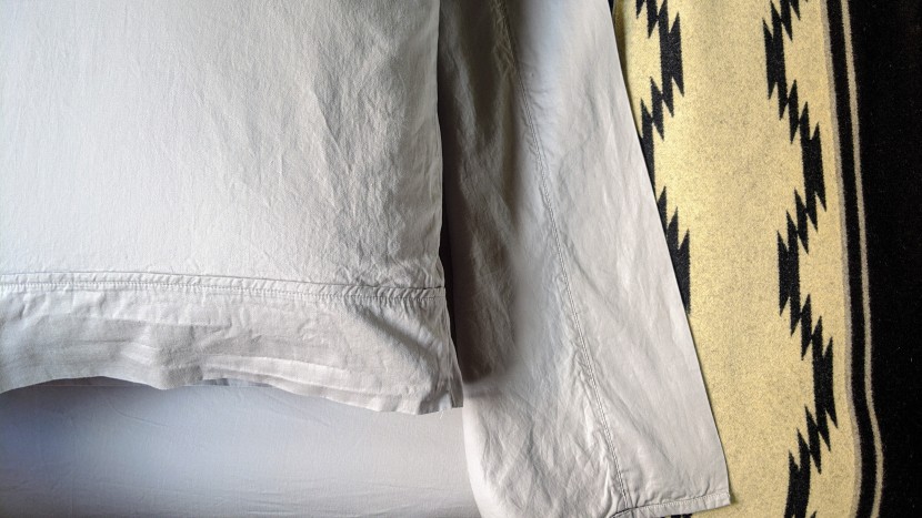 these sheets felt instantly fresh when laid out across our bed:...