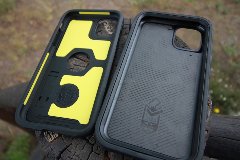 iphone 11 case - the spigen (left) and the otterbox defender (right) are compared...