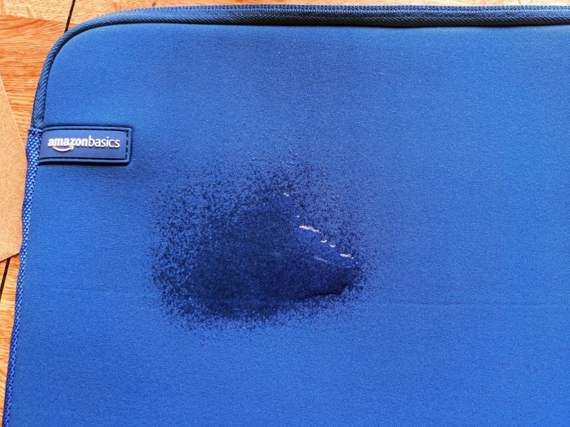 laptop sleeve - neoprene absorbs water quickly, whereas canvas sheds water.