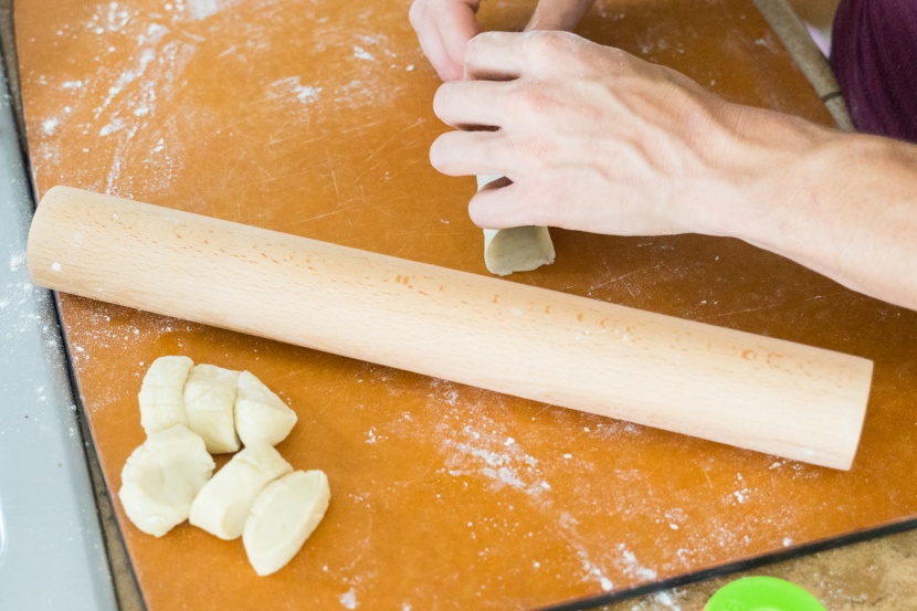 rolling pin - the j.k. adams dowel lies on the cutting board after being used to...