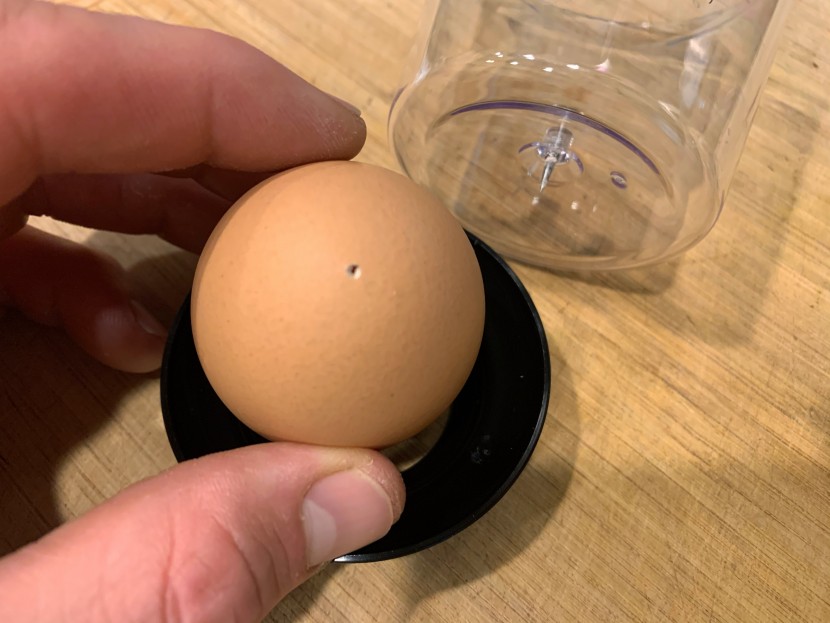 prepping an egg to get cooked
