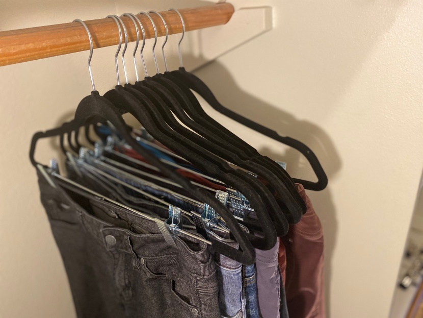 clothes hangers - this versatile hanger can either hang your pants using the clamps...