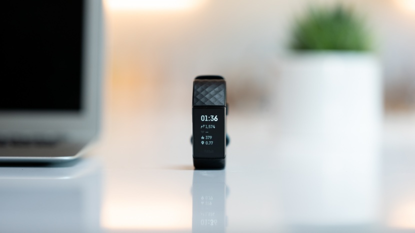 fitbit charge 4 - the display on this tracker shows all the basic information about...