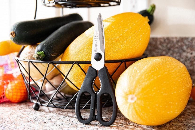 kitchen shears - the mercer culinary shears leaned up against some vegetables.