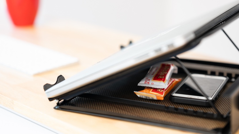 the amazonbasics model has a small compartment for storage and...