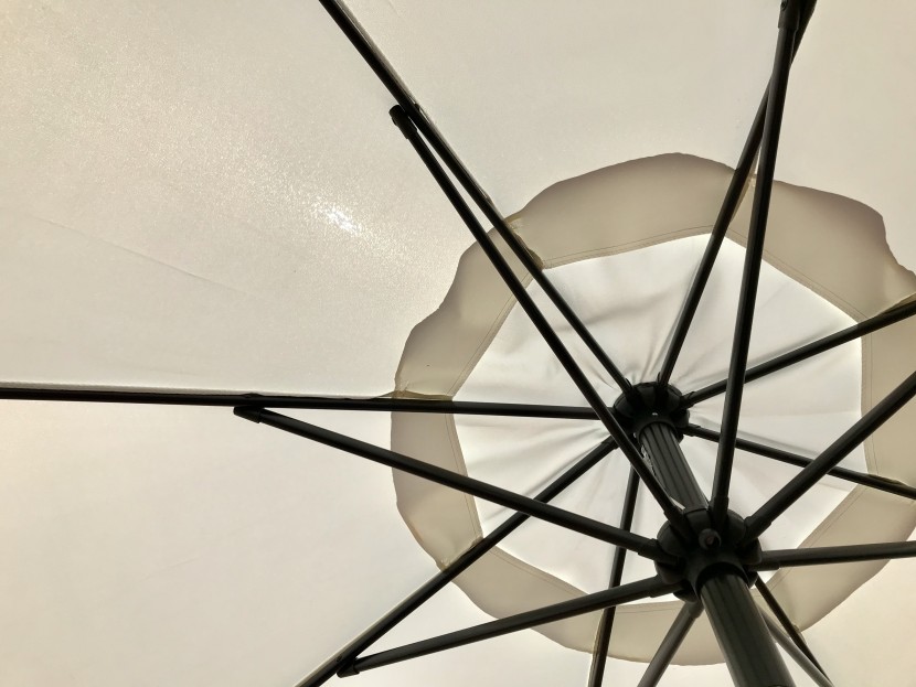 patio umbrella - the unihoos umbrella's white shade lets too much light in for our...