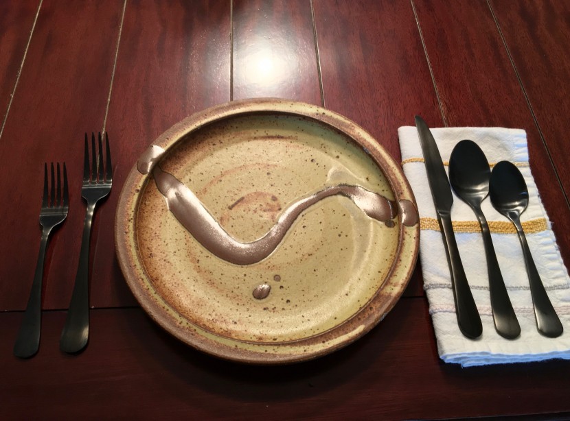 here you can see the size of the flatware in comparison to a...