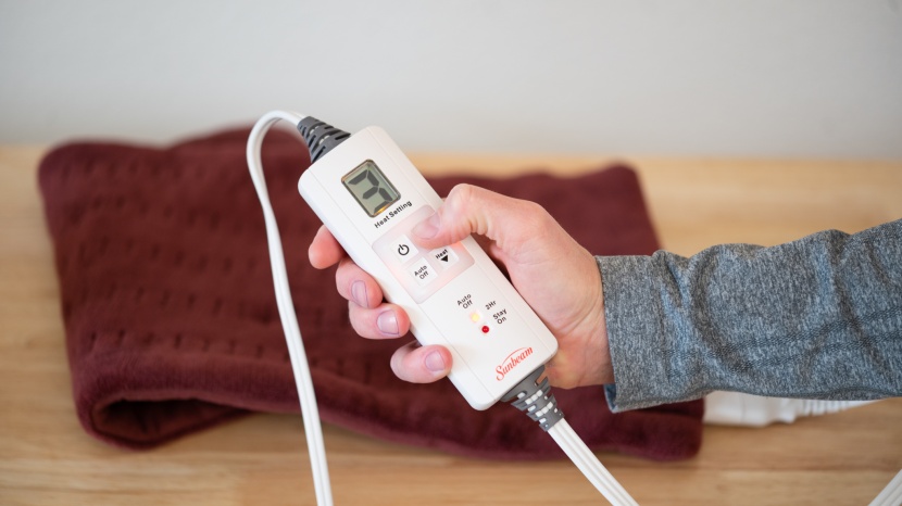 heating pad - the sunbeam xpressheat has six different heat settings, tying it...