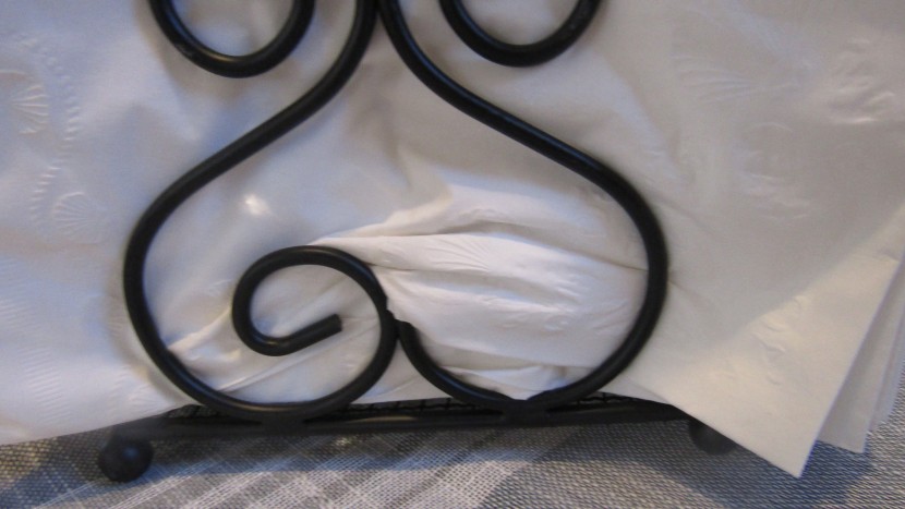 napkin holder - while putting napkins in the home basics scroll collection napkin...