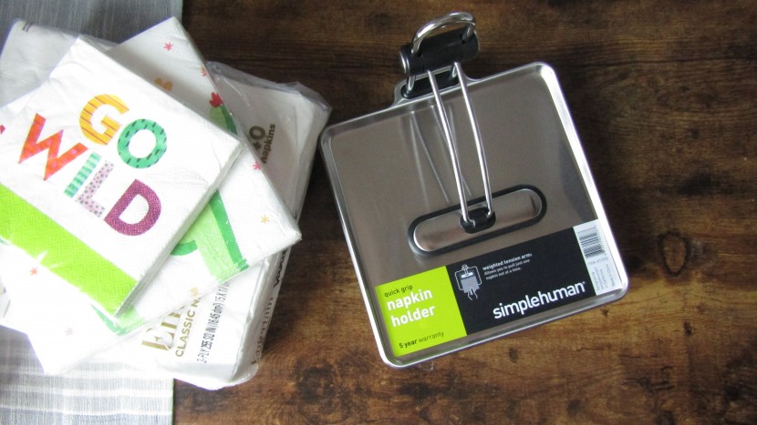 the simplehuman quick grip napkin dispenser has a weight to keep the...