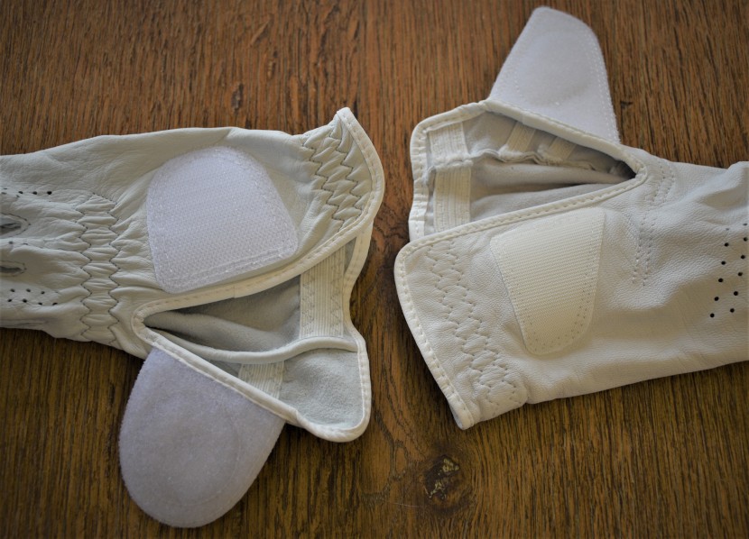 golf glove - the footjoy pure touch limited (left) has a much larger, thicker...