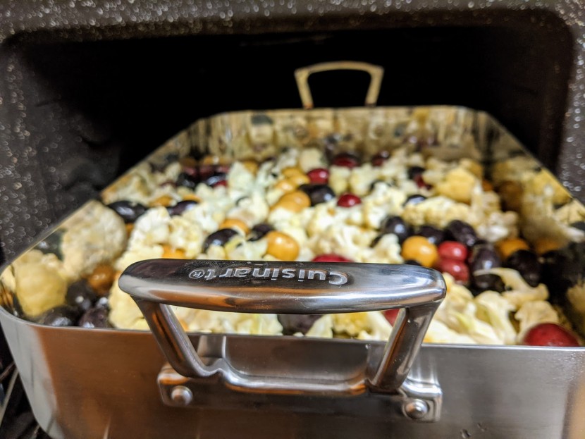 roasting pan - the large handles on the cuisinart make it easy to lift with oven...