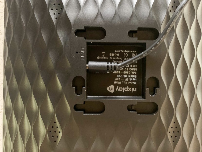 digital picture frame - the backing of the nixplay frame can slide off to reveal numerous...