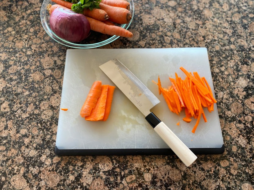 nakiri knife - the edge of this model cut better than we expected, but the wooden...