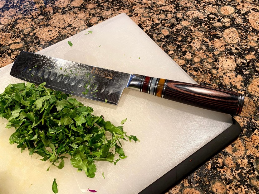 nakiri knife - the elegant handle helps offset the heft of this blade, which can...