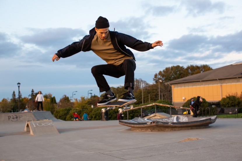 skateboard - adam doing an ollie while testing at the skatepark