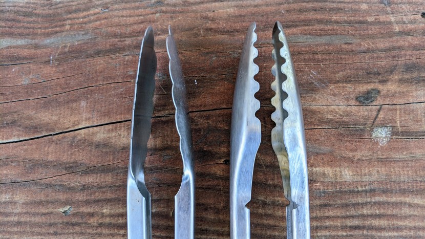 grill tools - comparing the scooped scallop-design of the weber tongs (right) with...