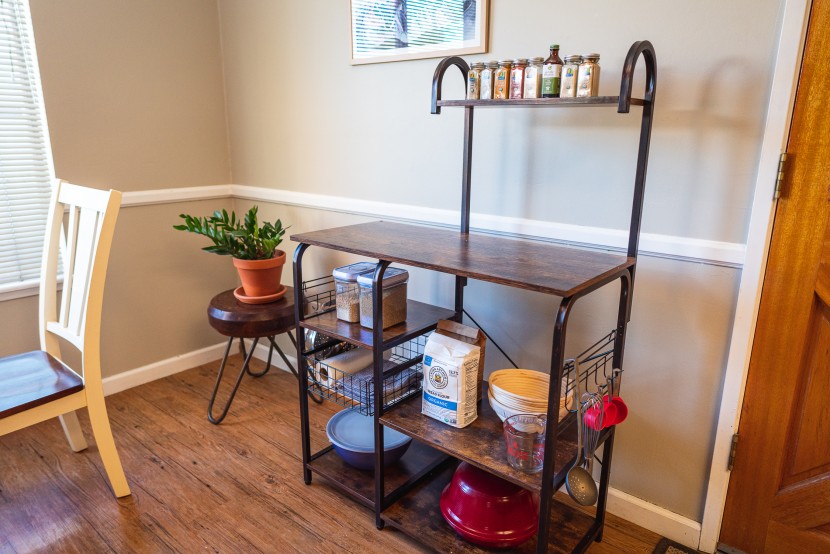 bakers rack - curved framing softens this rack's visual impact.