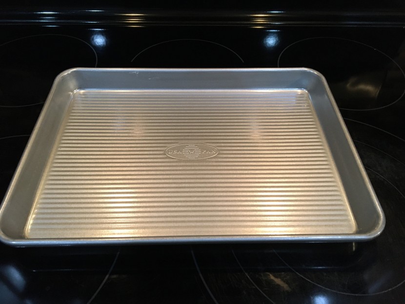 baking sheet - this heavy weight nonstick aluminum pan roasts and bakes evenly and...