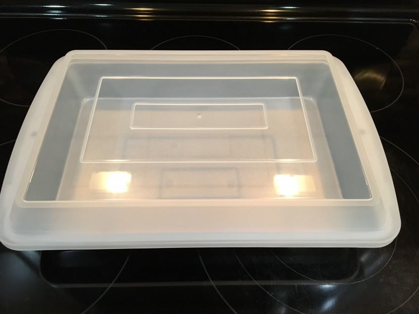 this non-stick 13" x 9" cake pan includes a plastic cover which is...