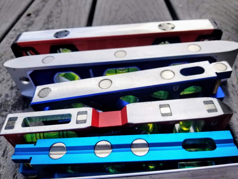 torpedo level - the grooved magnetic edge of the ideal level is in the foreground...